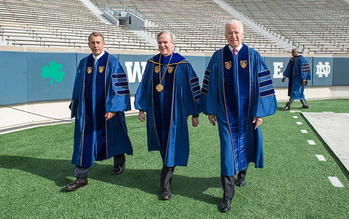 University of Notre Dame president Rev. John Jenkins, C.S.C. is flanked by Laetare Medal recipients, John Boehner, former Speaker of the House and Vice President Joe Biden as they walk to the stage for the 2016 Commencement Ceremony.