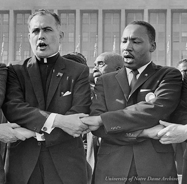 Rev. Theodore M. Hesburgh with Martin Luther King Jr., Rev. Edgar Chandler (far left), and Msgr. Robert J. Hagarty of Chicago (far right) at the Illinois Rally for Civil Rights in Chicago's Soldier Field.